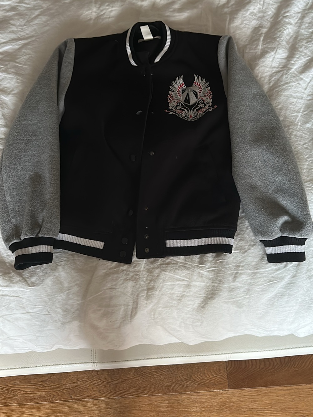 H&M Black Varsity Jacket with Gray Sleeves and Embroidered Crest